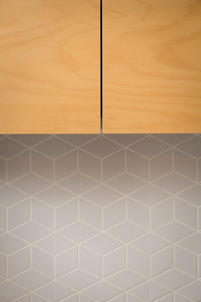 Inspiration for a modern kitchen in Perth with light wood cabinets, grey splashback and ceramic splashback.
