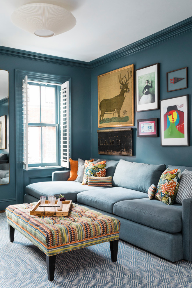 Example of a transitional living room design in Boston with blue walls