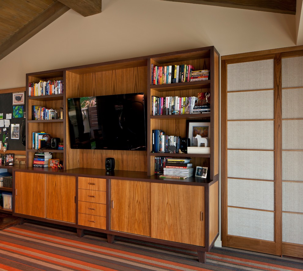 Mid-sized midcentury home office in Los Angeles with beige walls, carpet and red floor.