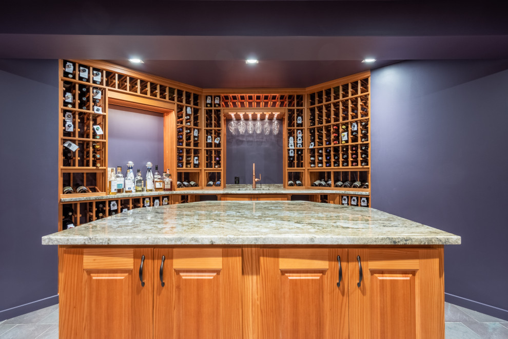 Inspiration for a large traditional wine cellar in Bridgeport with porcelain floors, storage racks and grey floor.