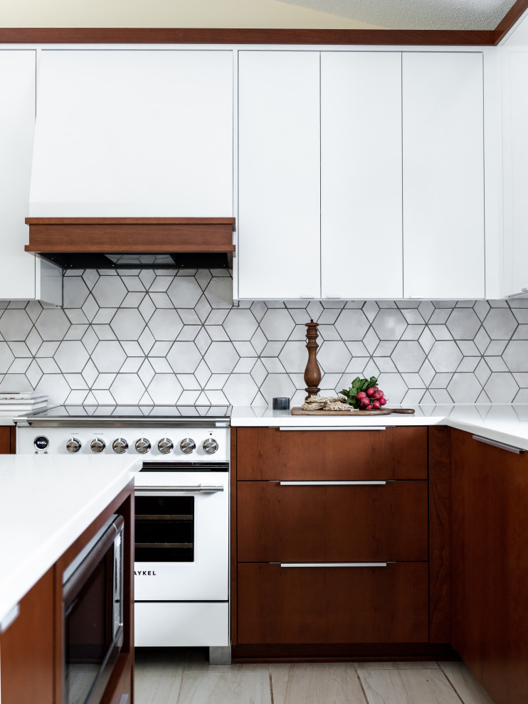 1950s l-shaped eat-in kitchen photo in Minneapolis with white cabinets, quartz countertops, gray backsplash, mosaic tile backsplash, white appliances and white countertops