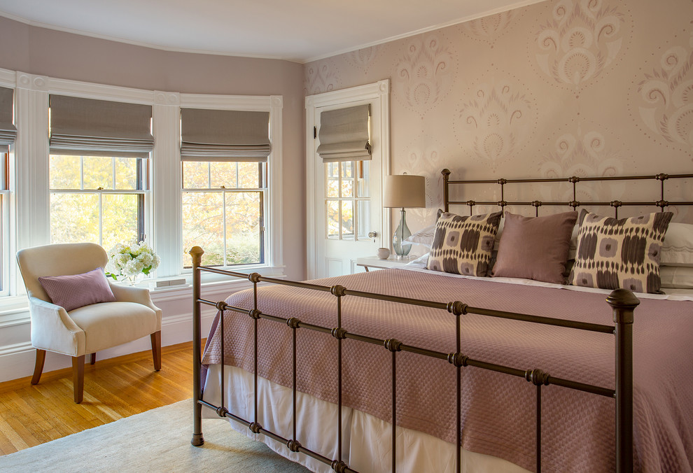 Design ideas for a mid-sized traditional master bedroom in Boston with light hardwood floors and purple walls.