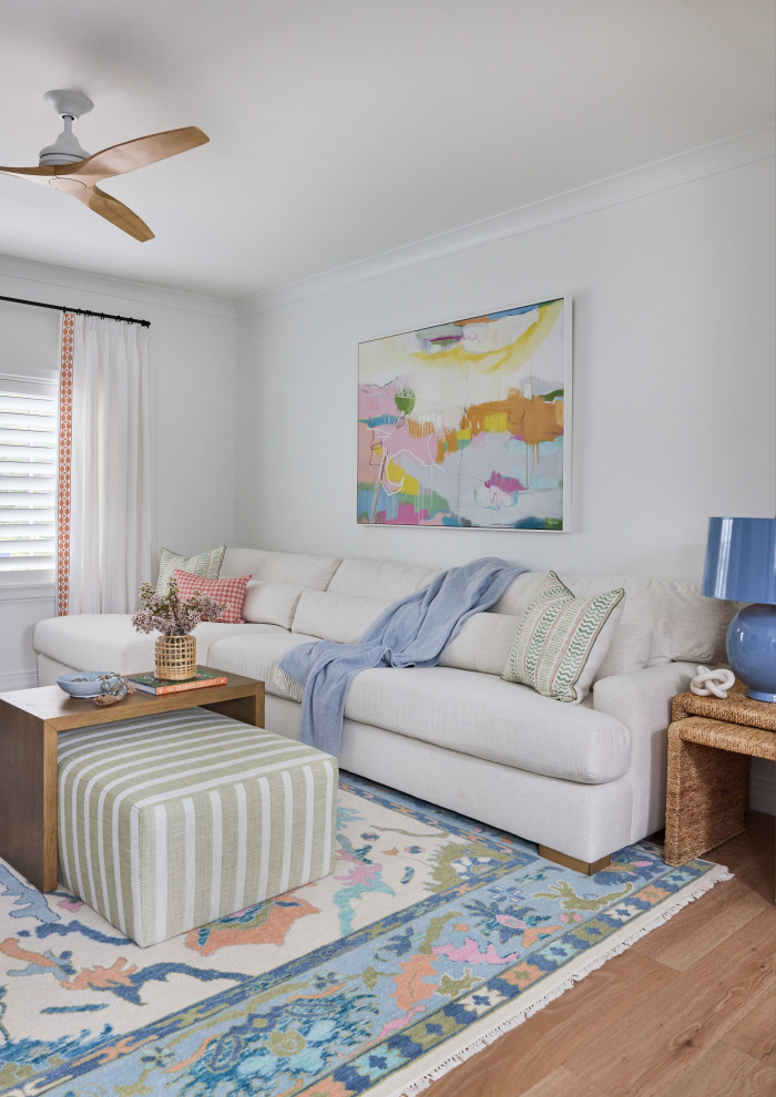2 Chicks Happy Family Home - Coastal Gathering Room with Soft Pastels and Tufted Ottoman. A bright, family-forward gathering room in a Ponte Vedra Beach custom home by 2 Chicks Design Co. A soft sectional, striped ottoman with wood bridge table, a colorful abstract painting, and oushak rug create a grown-up, gathered space that still welcomes the kids to in relax and hang with the family.
Tags: Playroom, Kids Room, Family Room, Coastal Kids, Pastel Palette