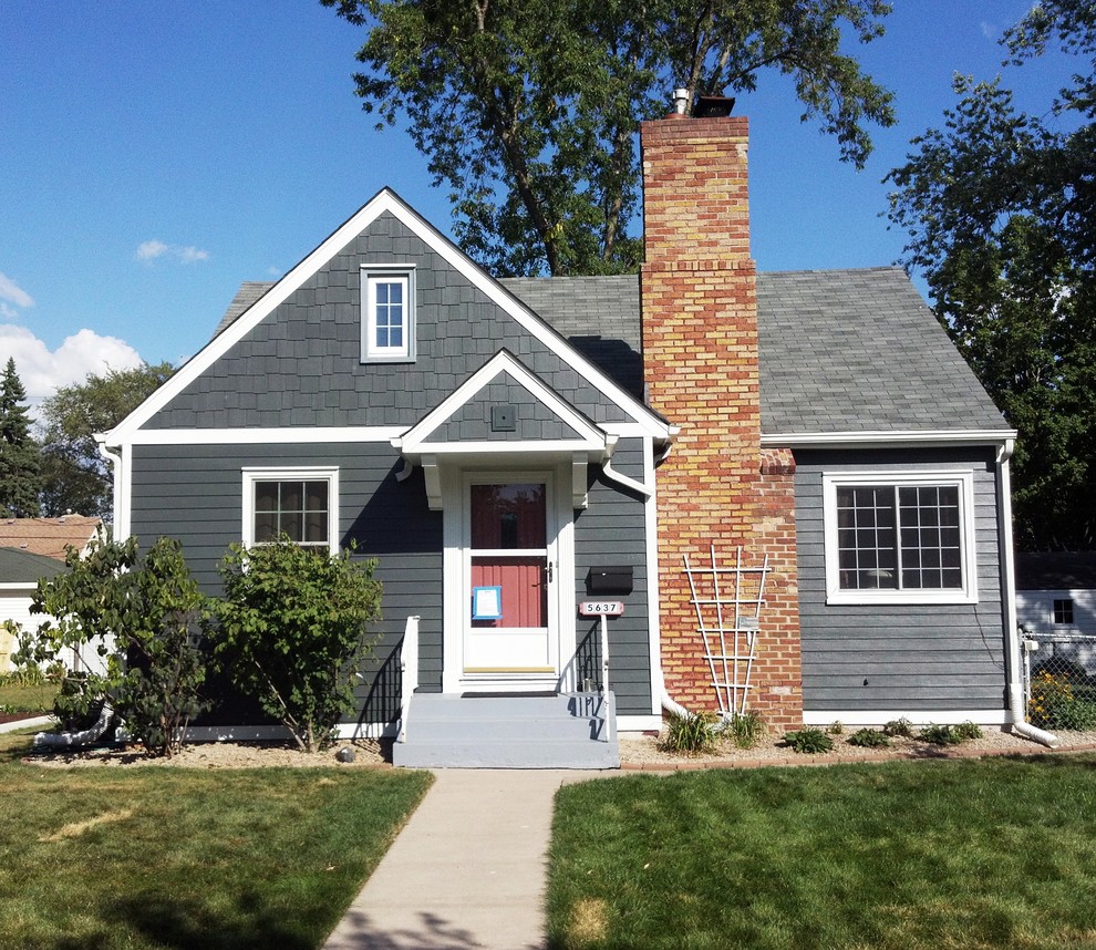 Small traditional one-storey grey exterior in Minneapolis with concrete fiberboard siding.