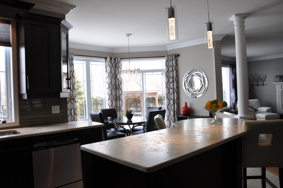 Example of a large transitional u-shaped ceramic tile open concept kitchen design in Ottawa with an undermount sink, shaker cabinets, dark wood cabinets, granite countertops, beige backsplash, glass tile backsplash, stainless steel appliances and an island