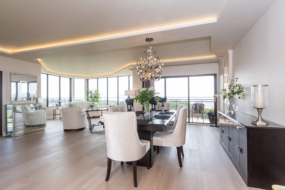 Inspiration for a large contemporary open plan dining in Toronto with white walls and light hardwood floors.