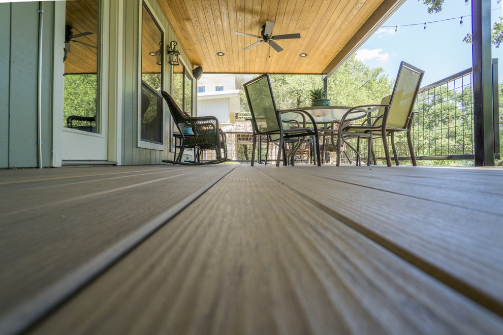 Large mountain style backyard balcony deck photo in Austin