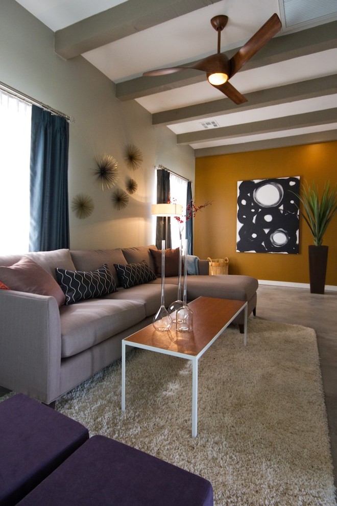 This is an example of a contemporary family room in Phoenix with yellow walls.