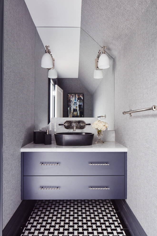 This is an example of an expansive classic cloakroom in Toronto with louvered cabinets, blue cabinets, a wall mounted toilet, multi-coloured tiles, mosaic tiles, multi-coloured walls, medium hardwood flooring, a vessel sink, marble worktops, brown floors, multi-coloured worktops, a built in vanity unit and wallpapered walls.