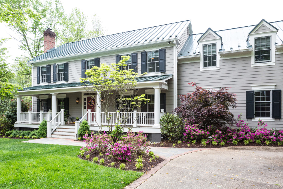 Elegant gray two-story clapboard exterior home photo in DC Metro with a metal roof and a gray roof