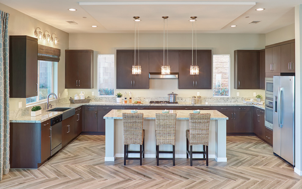 Kitchen - transitional light wood floor kitchen idea with a farmhouse sink, dark wood cabinets, stainless steel appliances and an island