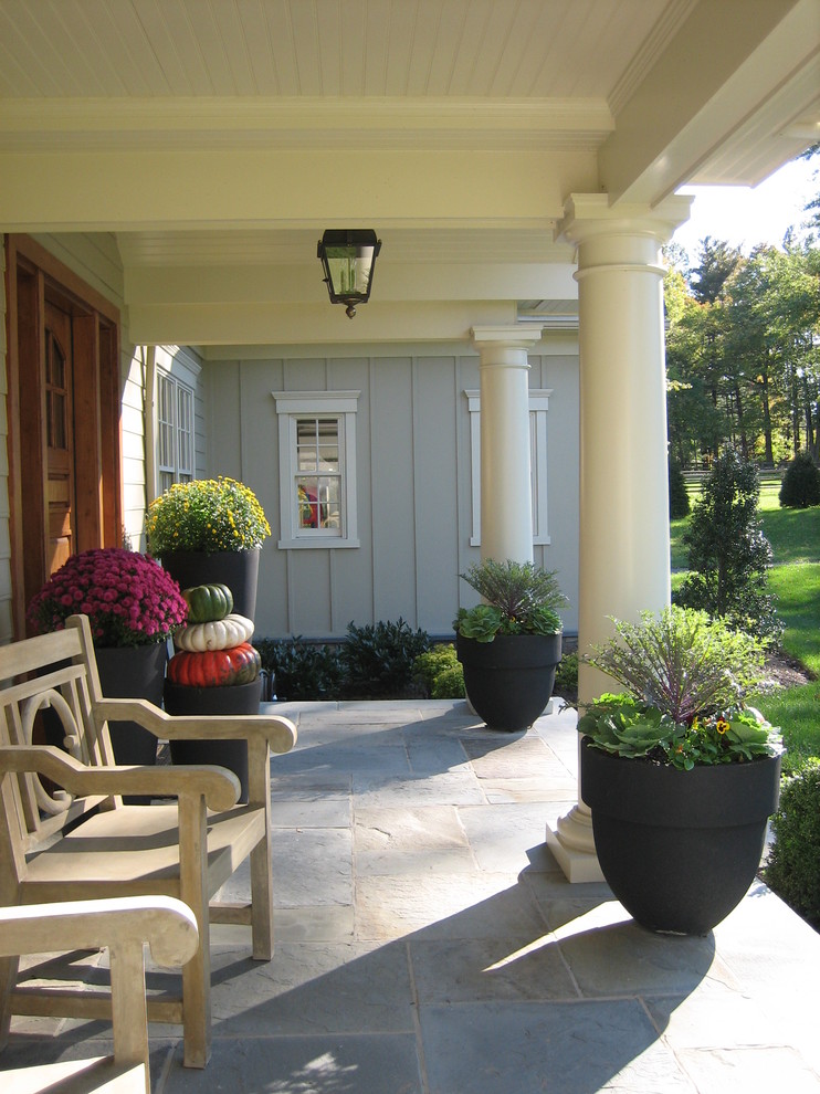 Design ideas for a traditional patio in Philadelphia with a roof extension.