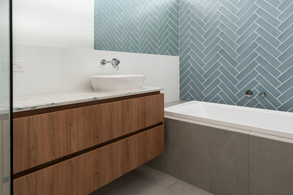 Photo of a modern bathroom in Adelaide with engineered quartz benchtops.