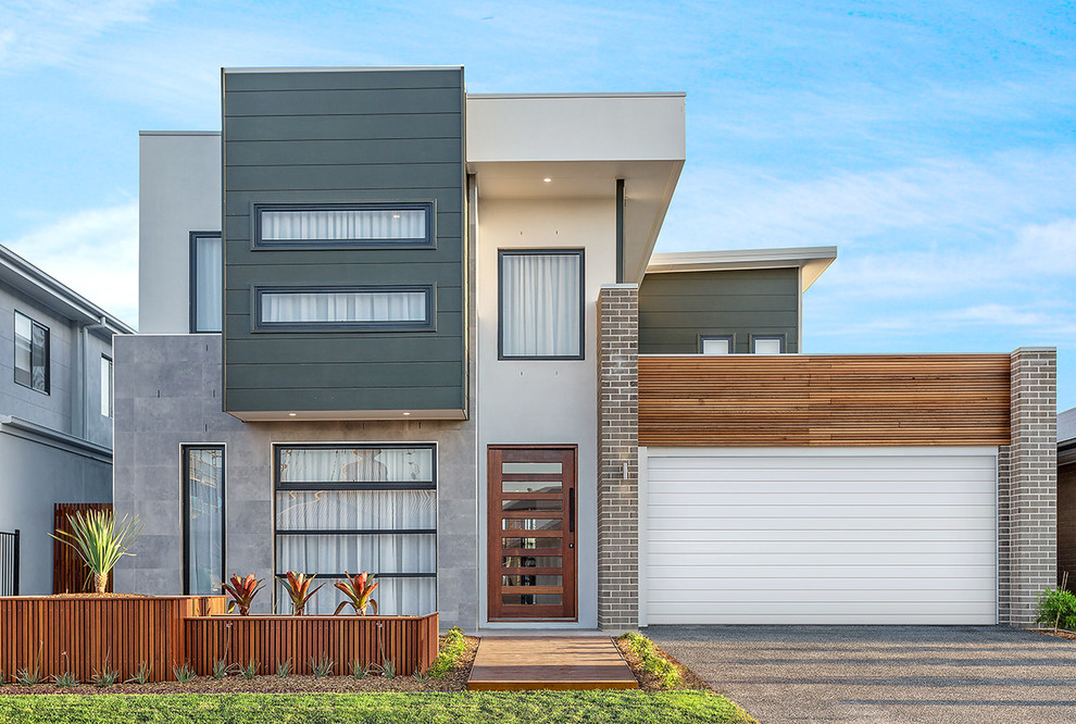 Contemporary two-storey multi-coloured house exterior in Brisbane with mixed siding and a flat roof.