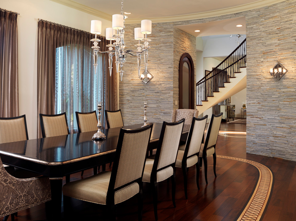 Photo of a contemporary dining room in Tampa with dark hardwood floors.