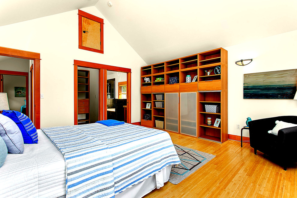 Mid-sized transitional kids' room in Seattle with beige walls and bamboo floors for boys.