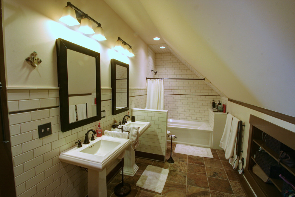 Photo of a country bathroom in Columbus with a pedestal sink and subway tile.