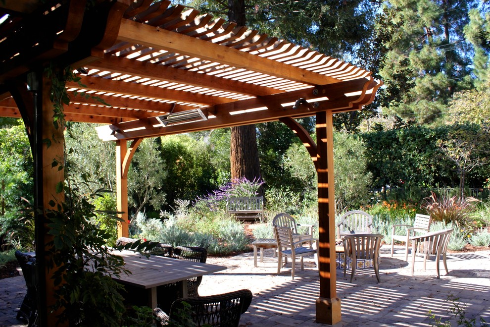 Mid-sized contemporary courtyard patio in San Francisco with tile and a pergola.