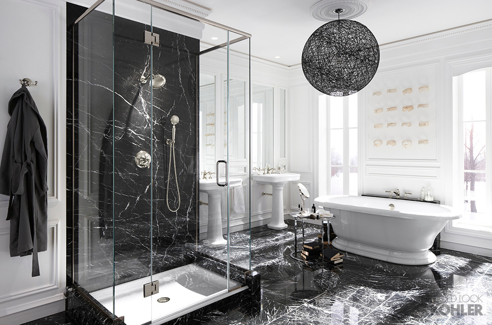 Photo of an expansive traditional master bathroom in Milwaukee with a pedestal sink, a freestanding tub, an alcove shower, white walls and marble floors.