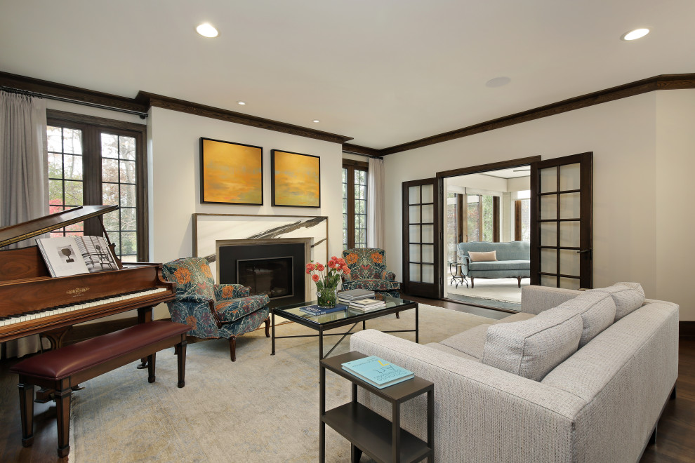 This is an example of a classic formal living room in Chicago with medium hardwood flooring and a standard fireplace.