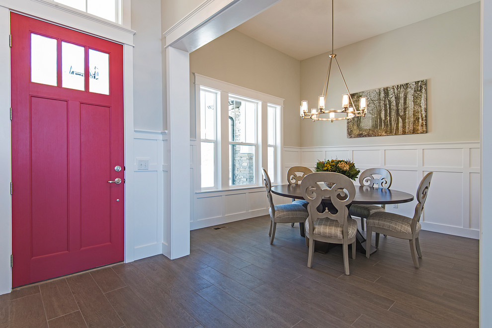 Inspiration for a mid-sized arts and crafts foyer in Salt Lake City with beige walls, light hardwood floors, a single front door and a red front door.