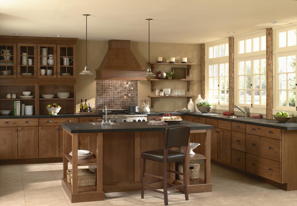 Inspiration for a mid-sized arts and crafts l-shaped eat-in kitchen in Orange County with a single-bowl sink, shaker cabinets, dark wood cabinets, soapstone benchtops, beige splashback, stainless steel appliances, ceramic floors, with island and beige floor.