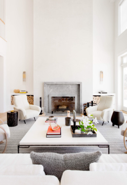 Inspiration for a large contemporary formal open concept living room in New York with white walls, light hardwood floors, a standard fireplace, a tile fireplace surround, no tv and beige floor.
