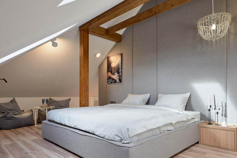 Contemporary bedroom in Moscow with grey walls, light hardwood floors, beige floor, exposed beam and vaulted.