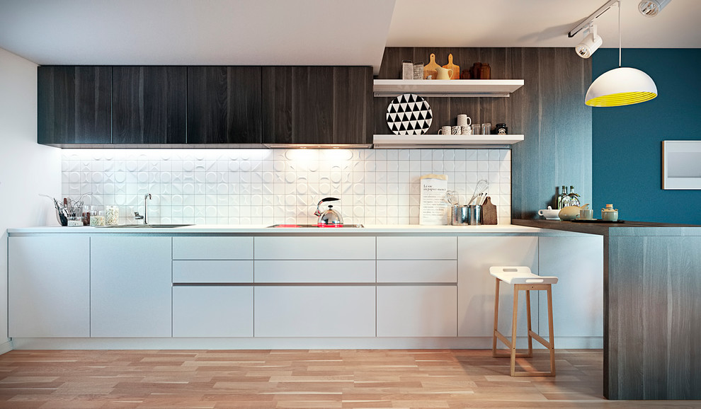This is an example of a scandinavian single-wall kitchen in Other with a drop-in sink, flat-panel cabinets, white cabinets, white splashback, ceramic splashback and light hardwood floors.