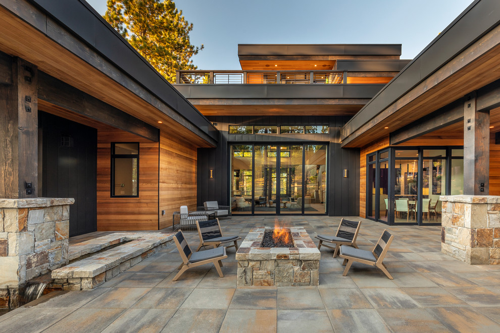 Inspiration for an expansive patio in Sacramento with a fire feature and concrete pavers.