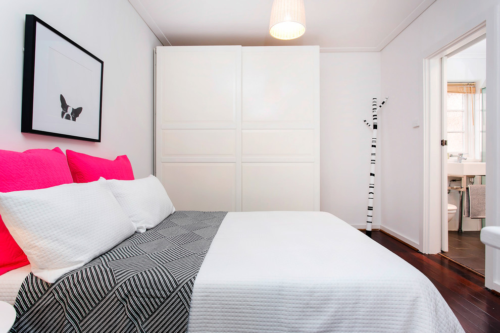 Inspiration for a contemporary guest bedroom in Adelaide with white walls, dark hardwood floors and brown floor.