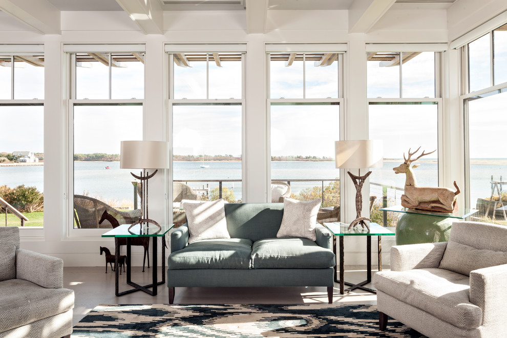 Inspiration for a beach style living room in Boston with white walls.