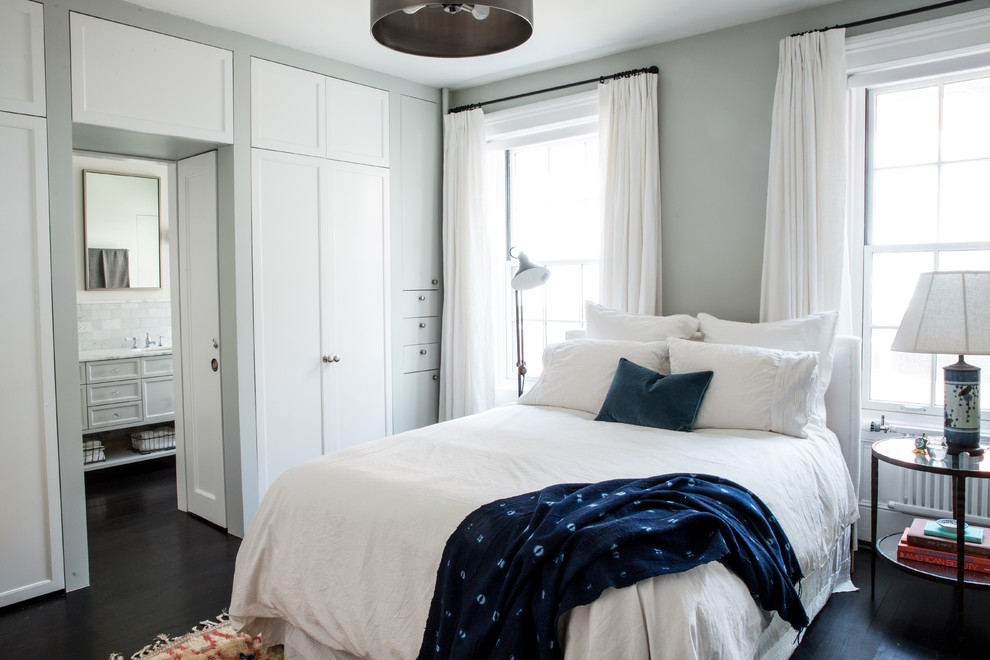Inspiration for a traditional master bedroom in New York with grey walls and dark hardwood floors.