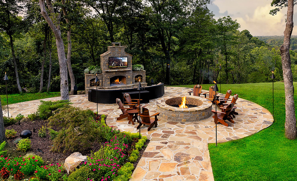 Design ideas for a large transitional partial sun backyard stone landscaping with a fire pit for summer.