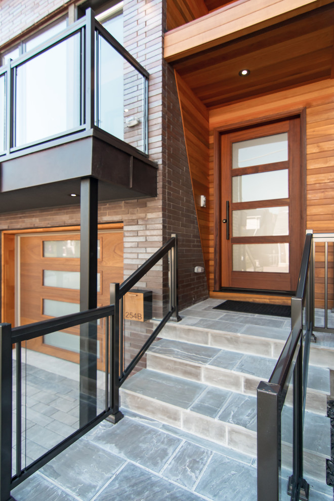 Photo of a mid-sized contemporary entryway in Toronto.