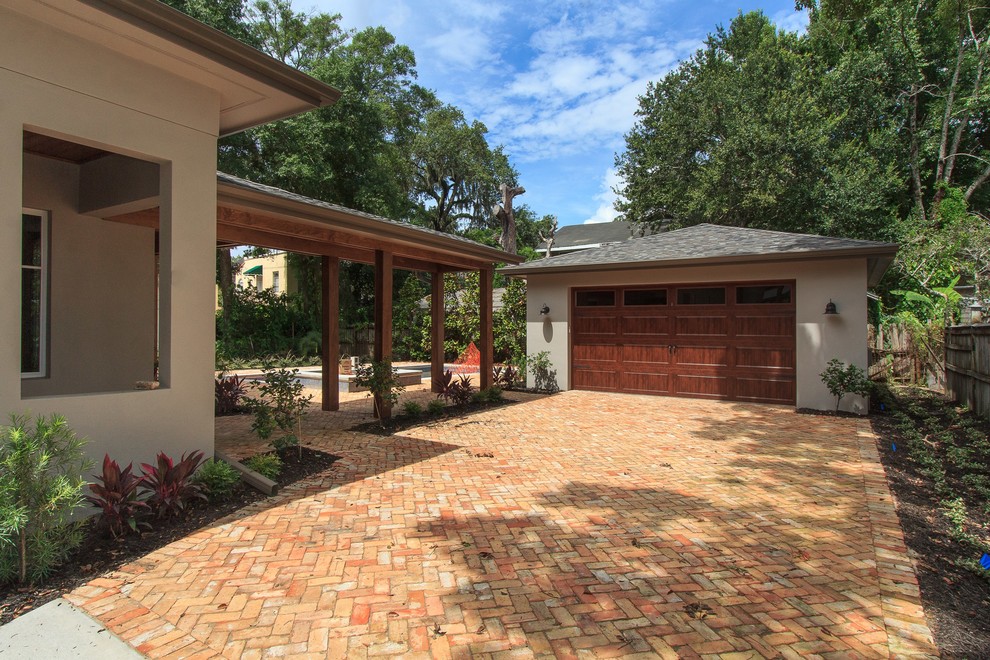Photo of a large transitional detached two-car garage in Orlando.