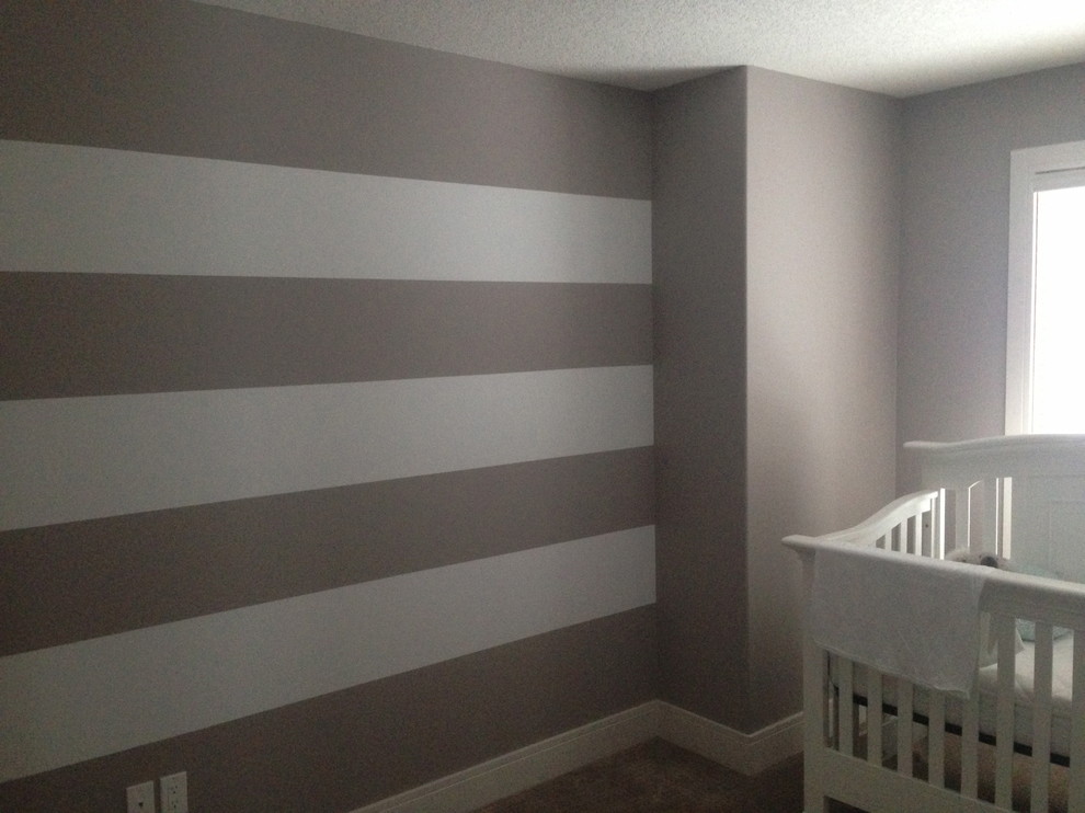 Photo of a mid-sized modern bedroom in Calgary with grey walls and carpet.