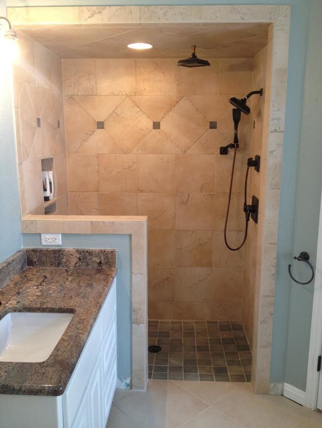 Design ideas for a mid-sized traditional master bathroom in Austin with raised-panel cabinets, white cabinets, an alcove shower, beige walls, ceramic floors, an undermount sink and granite benchtops.