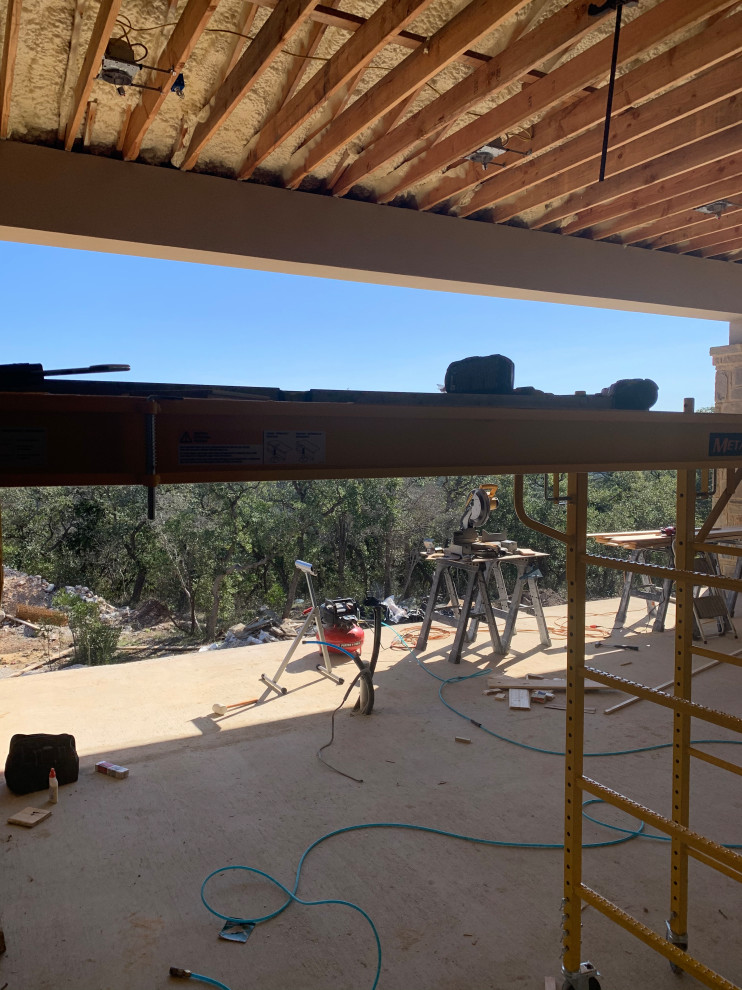 Example of a transitional home design design in Austin