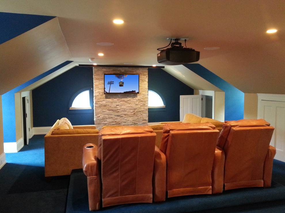Inspiration for a mid-sized traditional home theatre in Cleveland with beige walls and a projector screen.