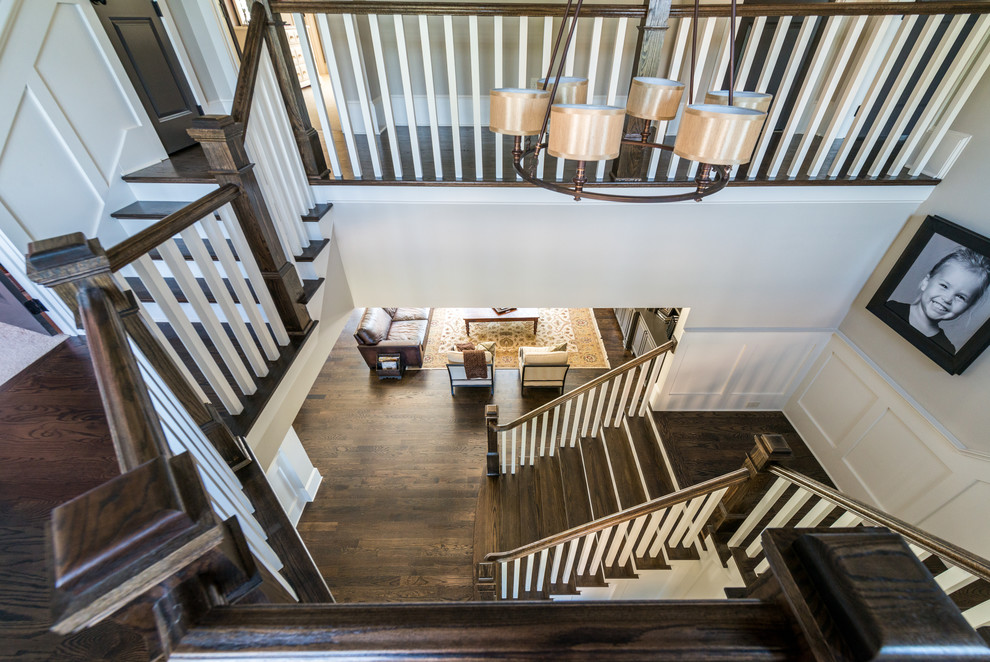 Photo of a mid-sized country wood u-shaped staircase in Atlanta with painted wood risers.