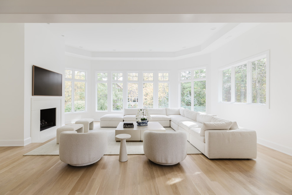 Spacious Modern Living Room with White Furniture and Large Windows