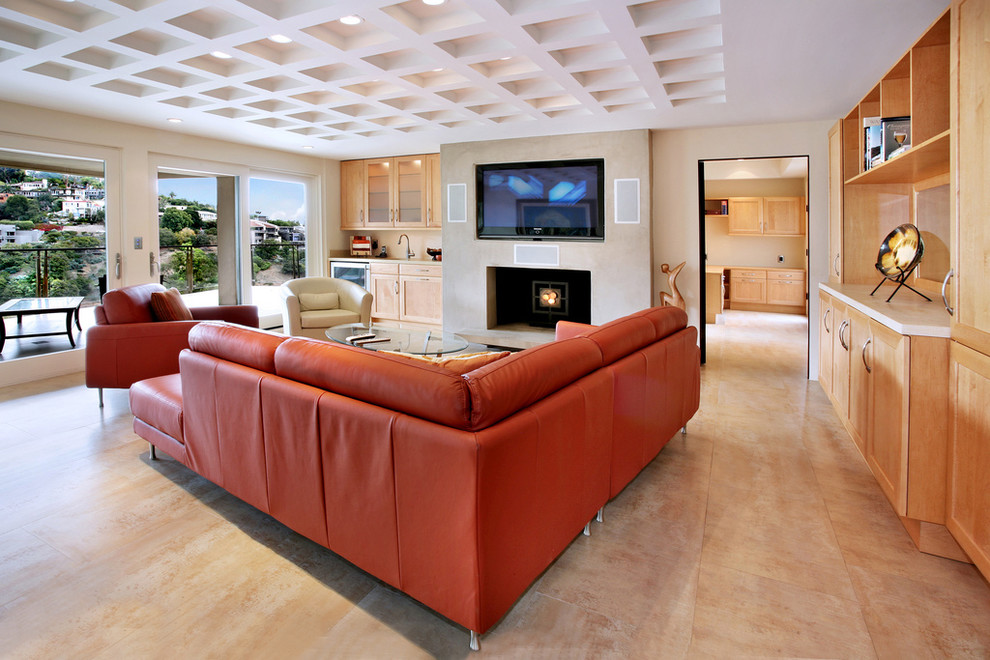 Photo of a large contemporary enclosed family room in Orange County with beige walls, travertine floors, a standard fireplace, a built-in media wall, a plaster fireplace surround and beige floor.