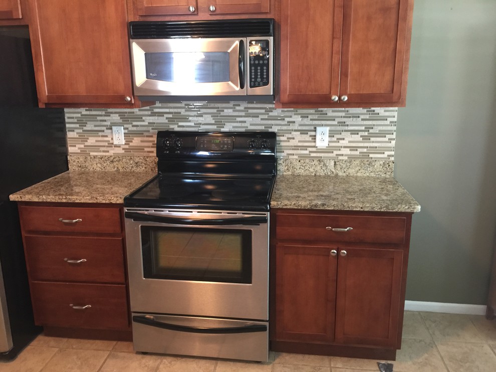 Kitchen - kitchen idea with glass tile backsplash