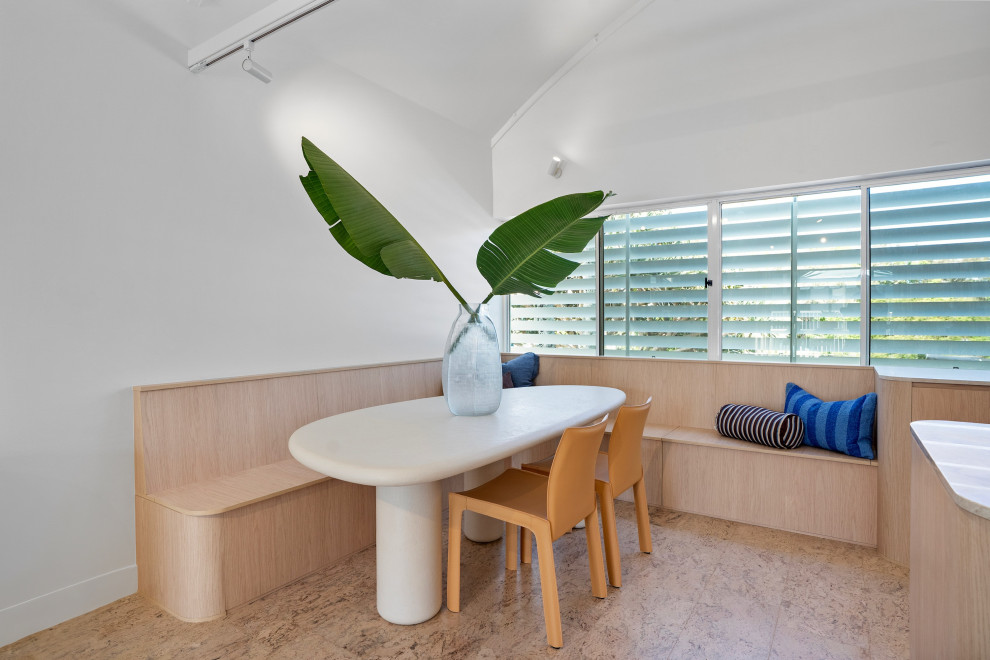 Photo of a beach style dining room in Sunshine Coast.