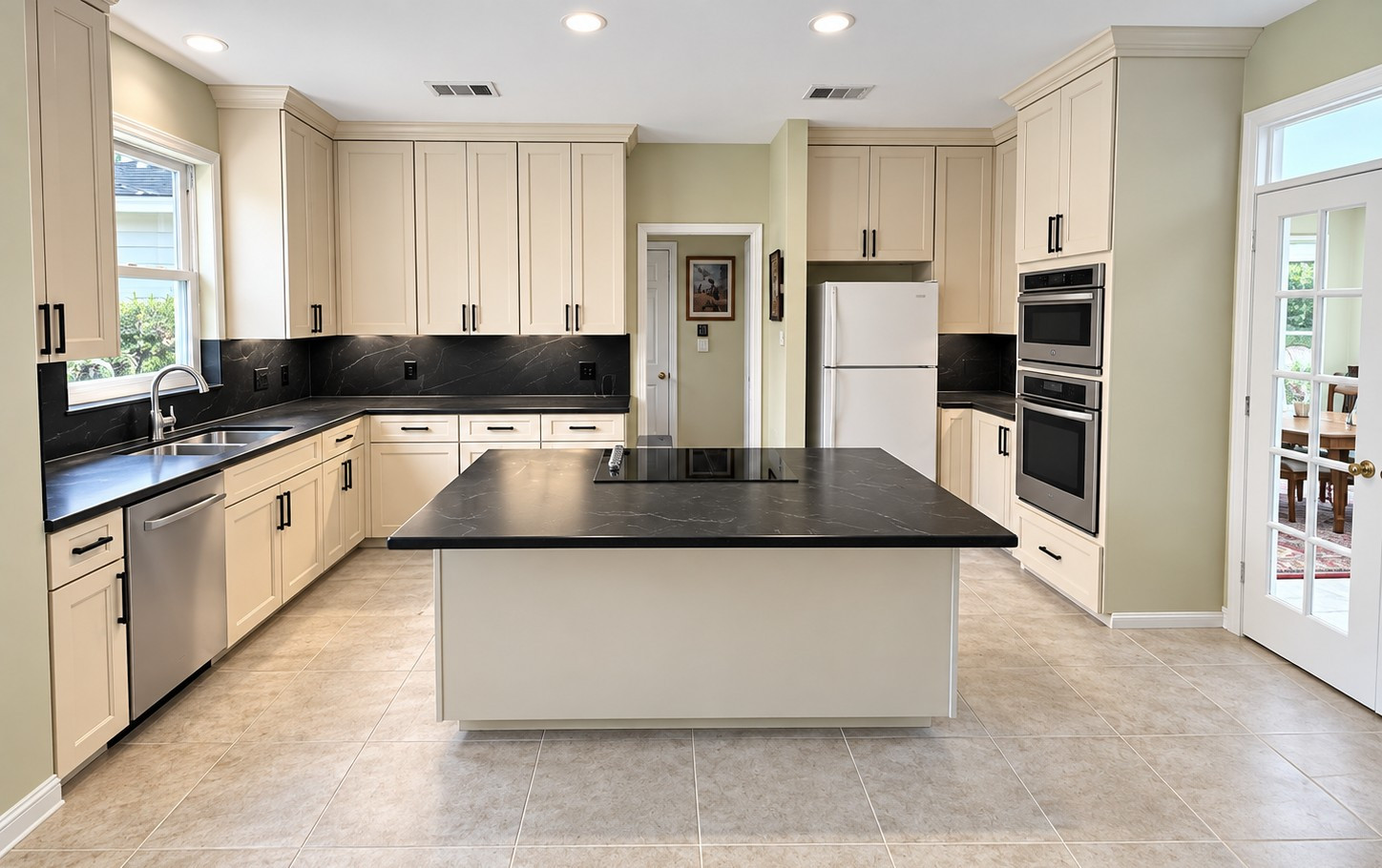 Custom Transitional Kitchen with Cream Shaker Cabinets & Black Countertops