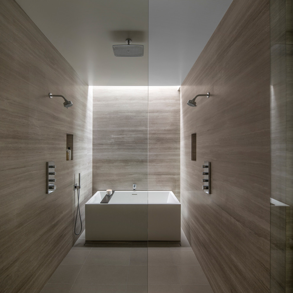 Photo of a mid-sized modern master bathroom in Phoenix with a freestanding tub, a curbless shower, gray tile, stone slab and porcelain floors.