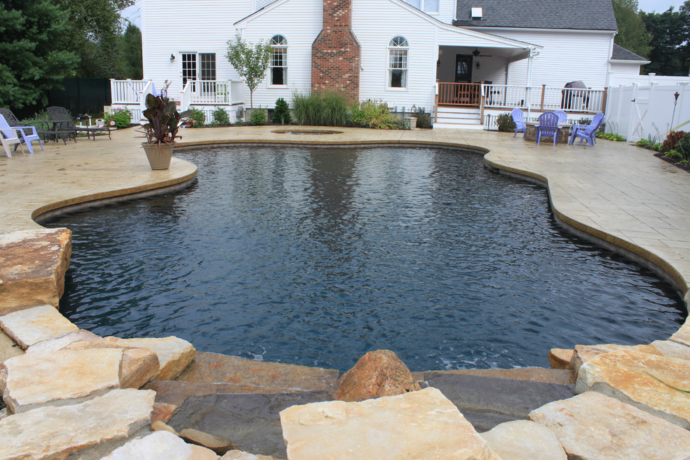 Inspiration for a rustic pool remodel in Boston