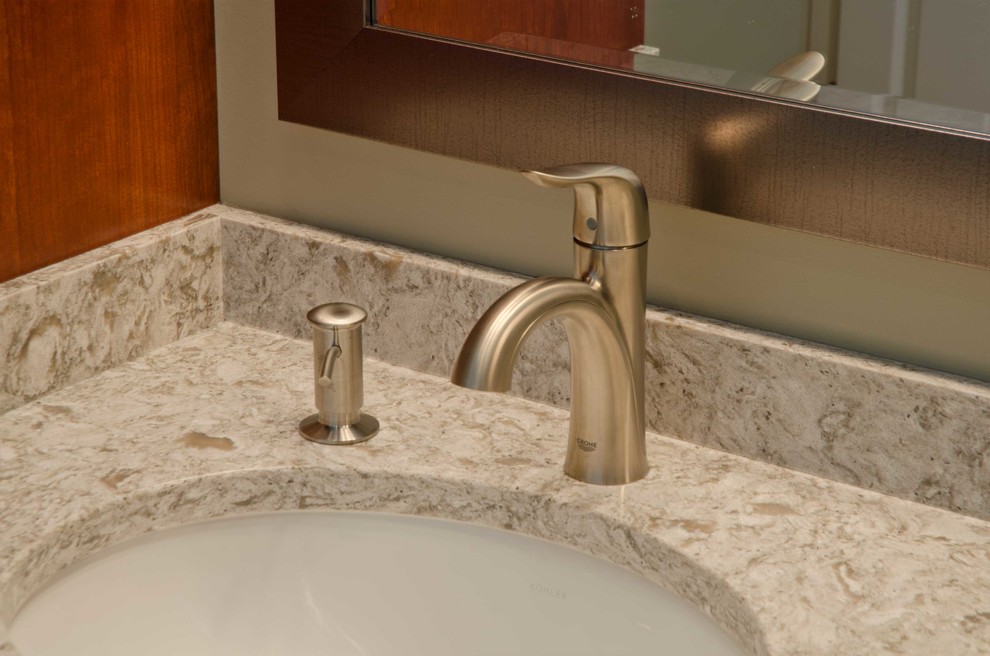 Doorless shower - large traditional master beige tile and ceramic tile ceramic tile doorless shower idea in Minneapolis with recessed-panel cabinets, dark wood cabinets, marble countertops, a two-piece toilet, beige walls and an undermount sink