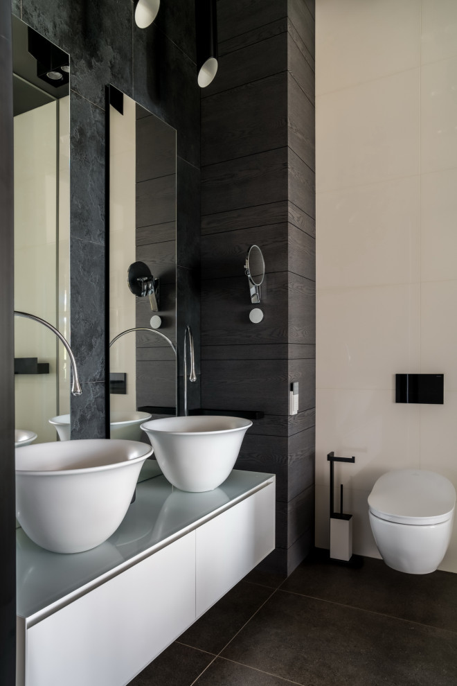 Mid-sized contemporary bathroom in Moscow with flat-panel cabinets, grey cabinets, a wall-mount toilet, beige tile, gray tile, a vessel sink, black floor, grey benchtops, a double vanity and a floating vanity.